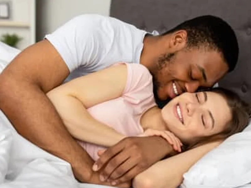 Couple resting comfortably together in the morning
